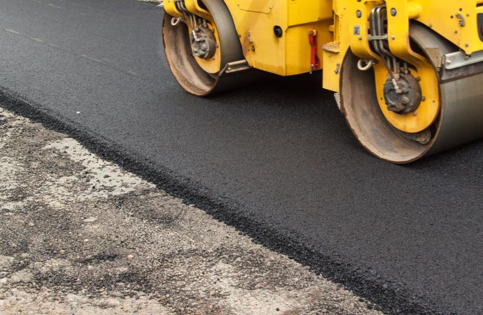 Asphalt paving repair service fixing cracks and damages for a smoother surface.