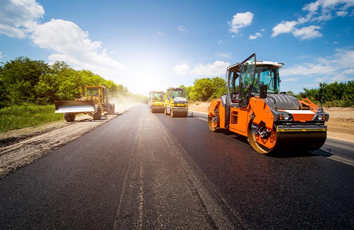 Commercial asphalt roadway repair is underway for smoother and safer driving.