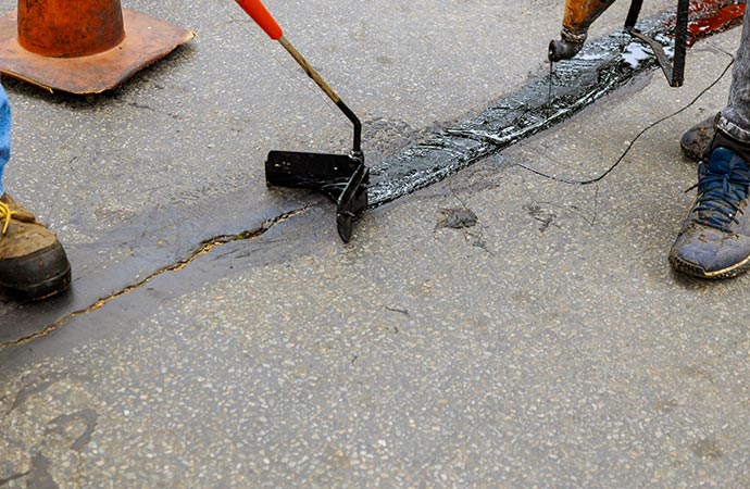 Repairing road cracks for better driving conditions