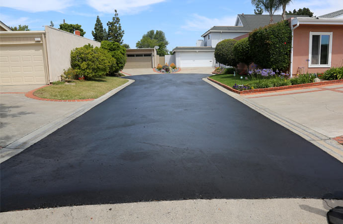 Private driveway and street rehabilitation with slurry seal.